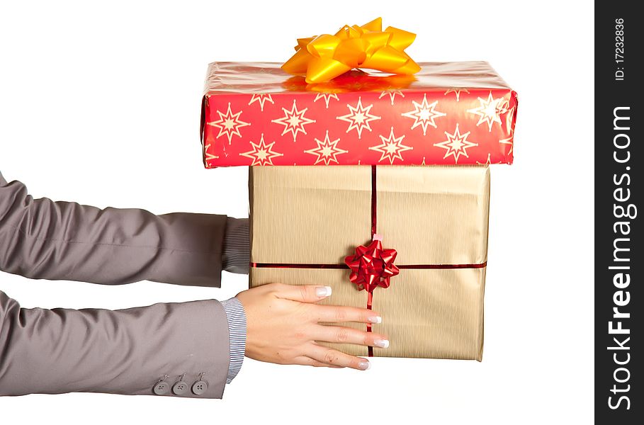 Woman hand holding christmas present on white background