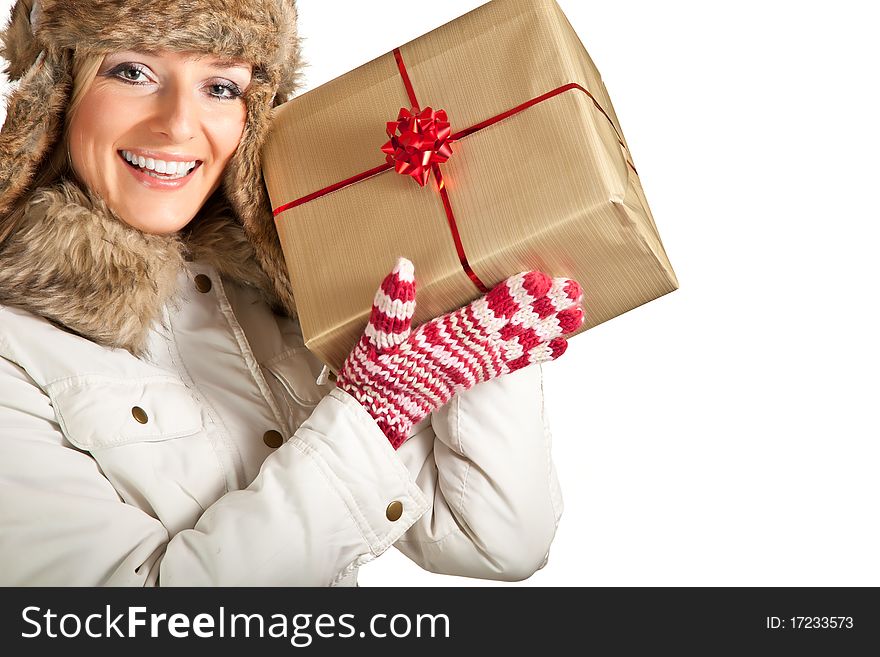 Caucasian blond woman in furry hat and christmas gifts isolated on white