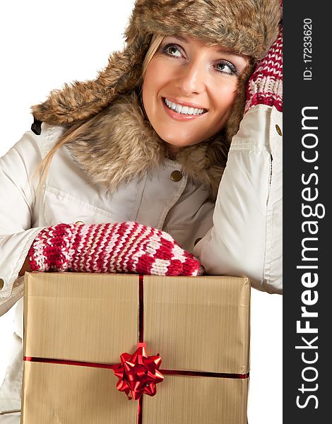 Caucasian blond woman in furry hat and christmas gifts isolated on white