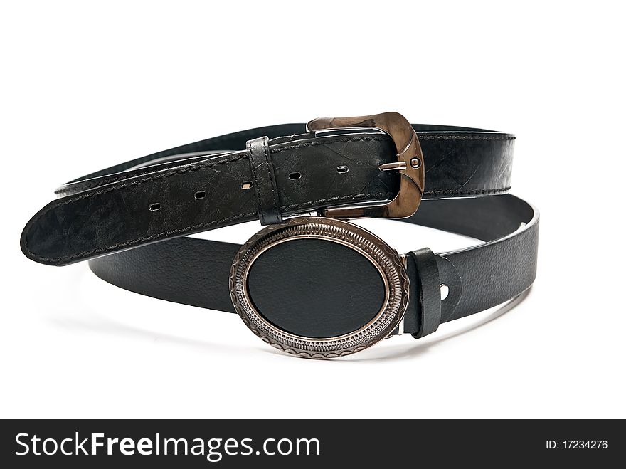 Two leather belts isolated on white background. Two leather belts isolated on white background