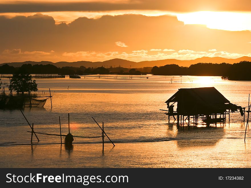 Fisherman lifestyle on sunset at Thailand