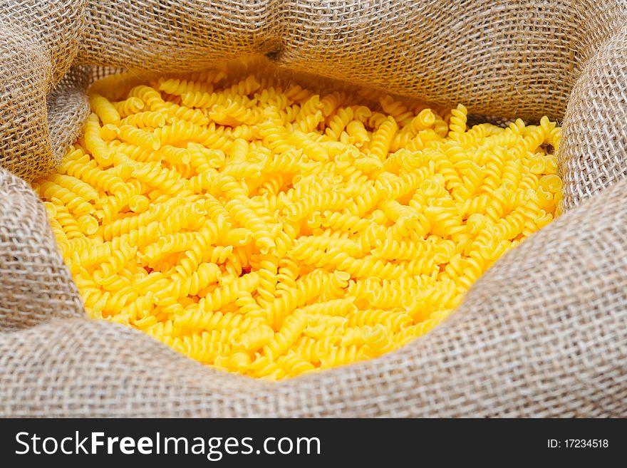 Many of noodles in a jute bag.