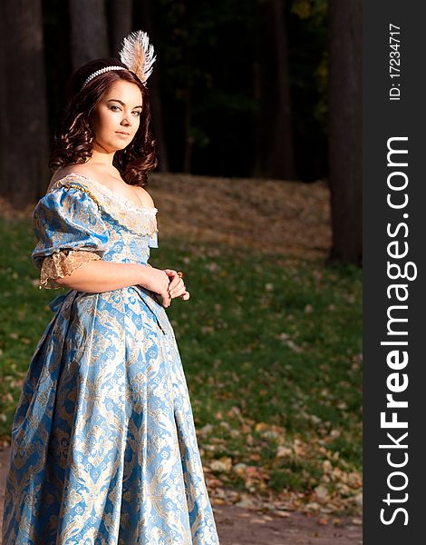 A portrait of lady in a blue baroque dress. A portrait of lady in a blue baroque dress