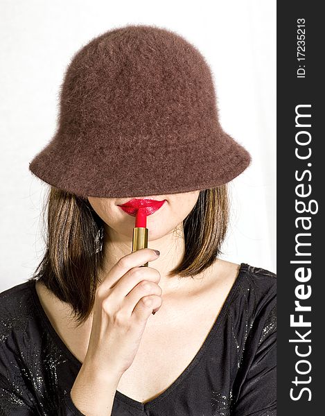 Woman Applying Red Lipstick On Lips