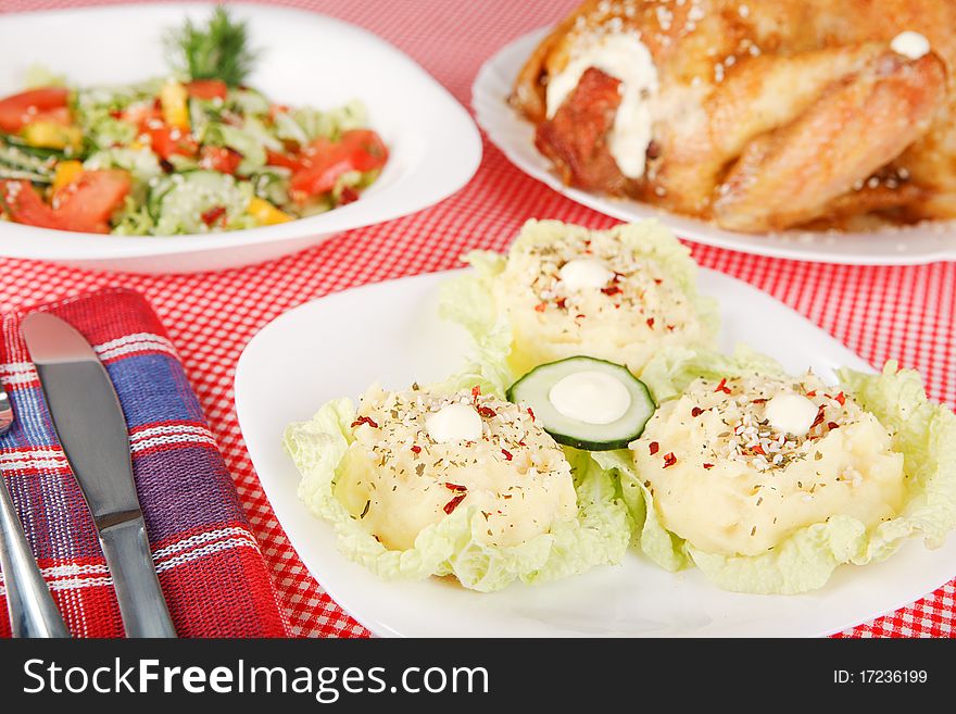 Mashed potatoes and fried chicken on the table