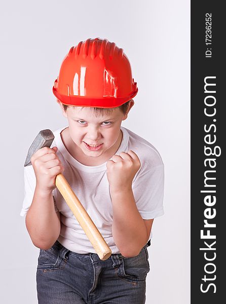Portrait of a boy in a red protective helmet