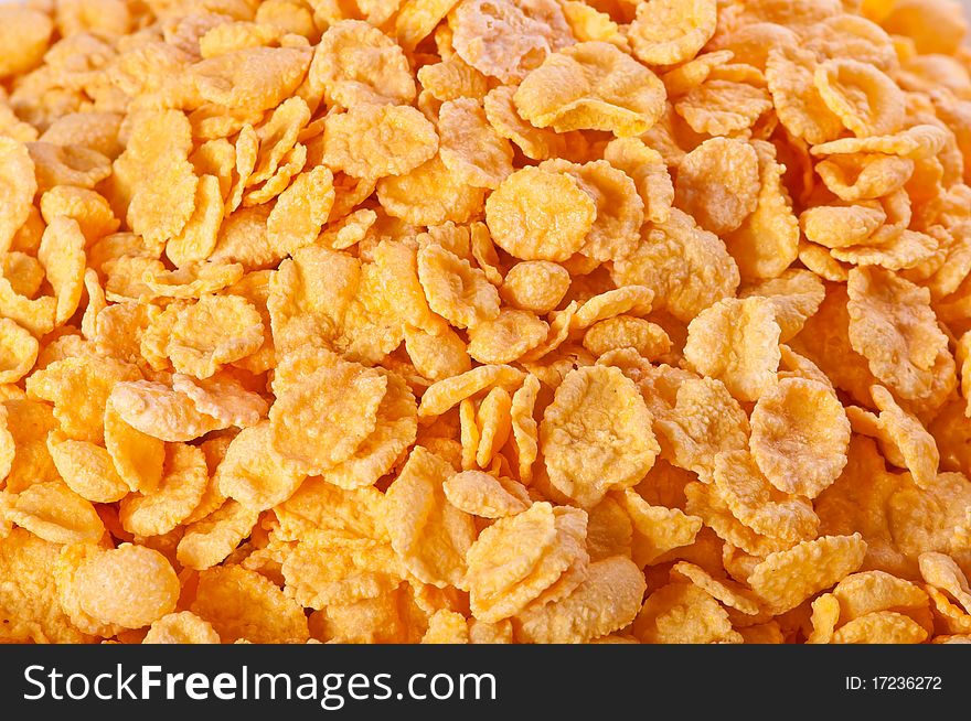 Goldish corn flakes. Macro with extremely shallow dof. Close-up of cornflakes.