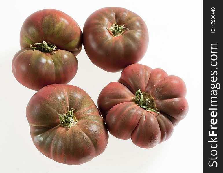 Still life of four tomatoes