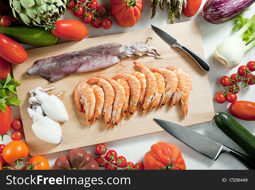 Still life of raw seafood and vegetables