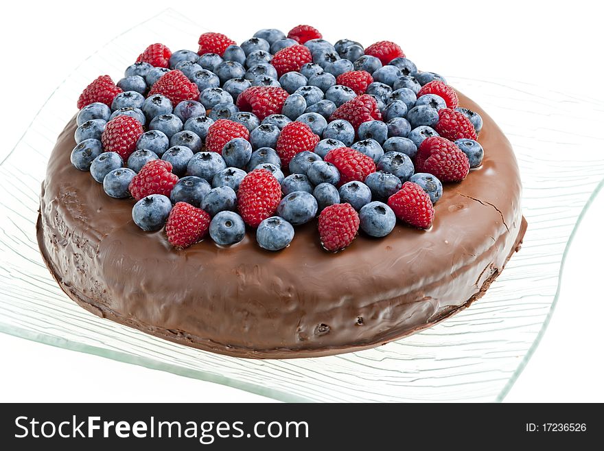 Chocolate cake with raspberries and blueberries