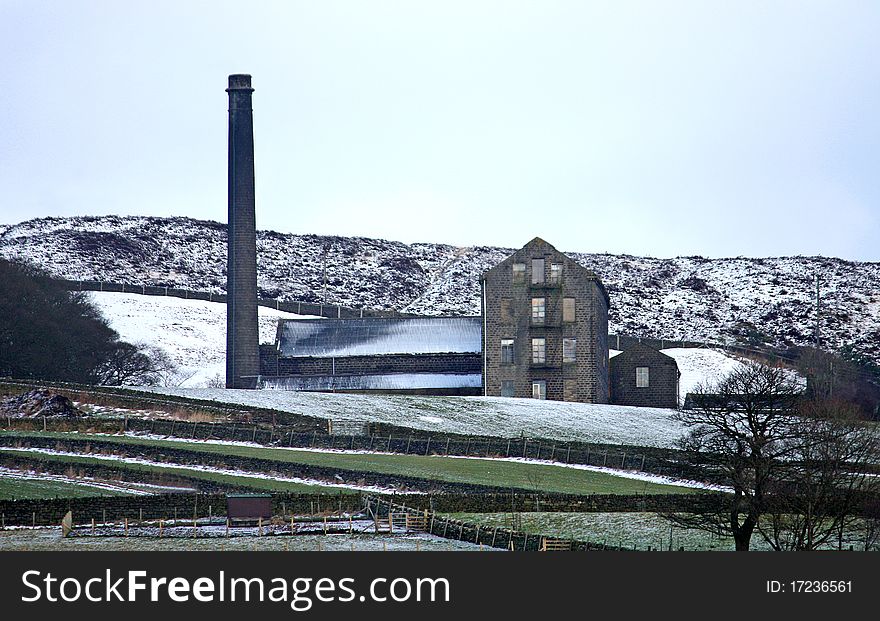 A Traditional Yorkshire Mill on a Snow Covered Hillside. A Traditional Yorkshire Mill on a Snow Covered Hillside.
