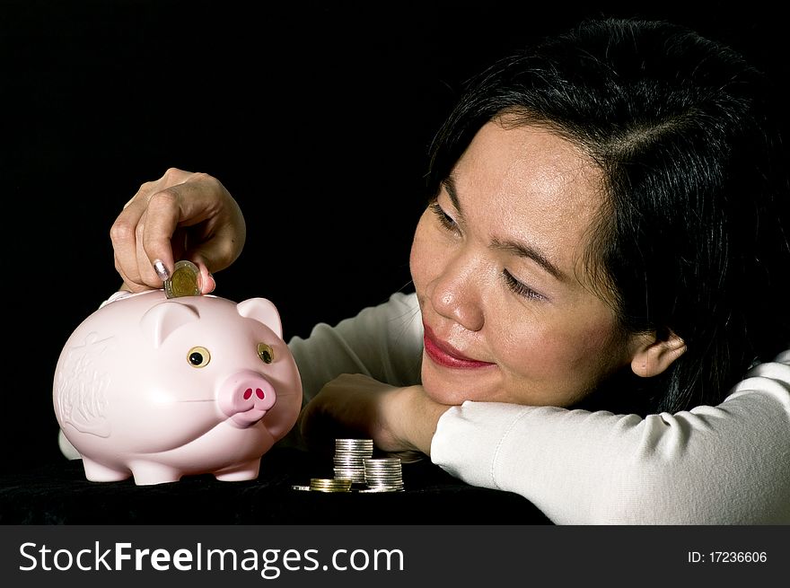 Young Woman With Pink Piggy Bank