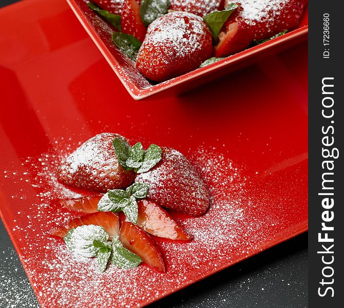 Sugared strawberries with mint leaves