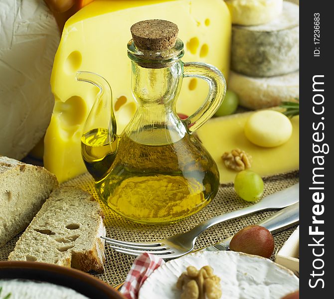 Cheese still life with olive oil