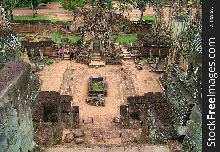 A tomb seen from the top of a pyramid's stairs in the Angkor Thom archeological site. A tomb seen from the top of a pyramid's stairs in the Angkor Thom archeological site
