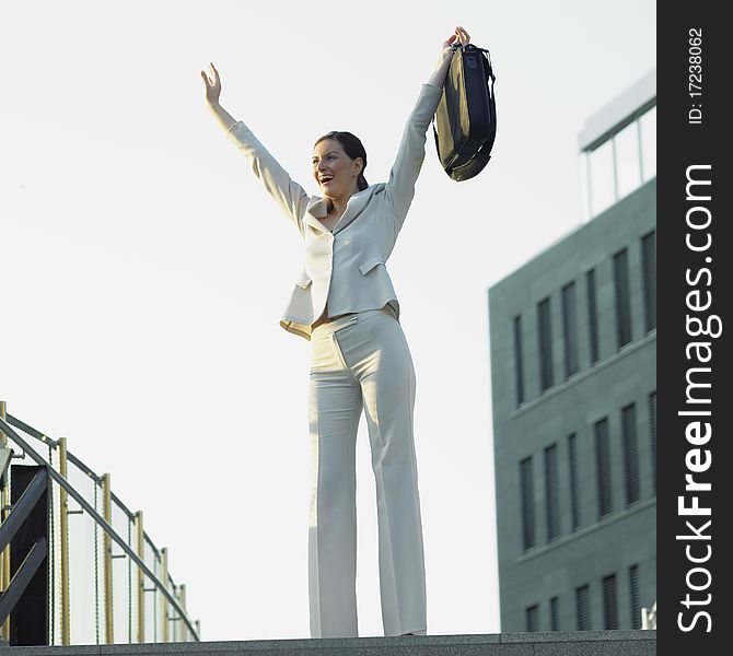 Standing businesswoman with a notebook