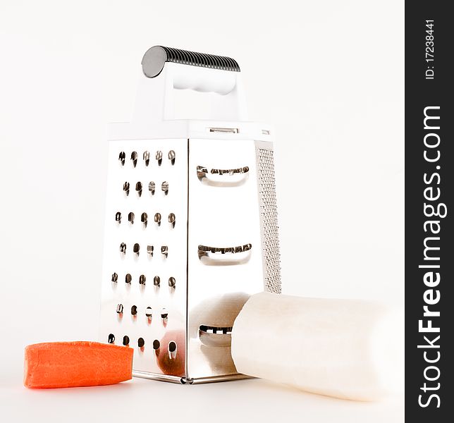 Grater with carrot and radish