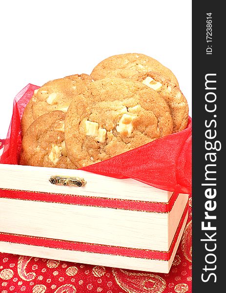 White chocolate and macadamia nut cookies in decorated box on white background. White chocolate and macadamia nut cookies in decorated box on white background