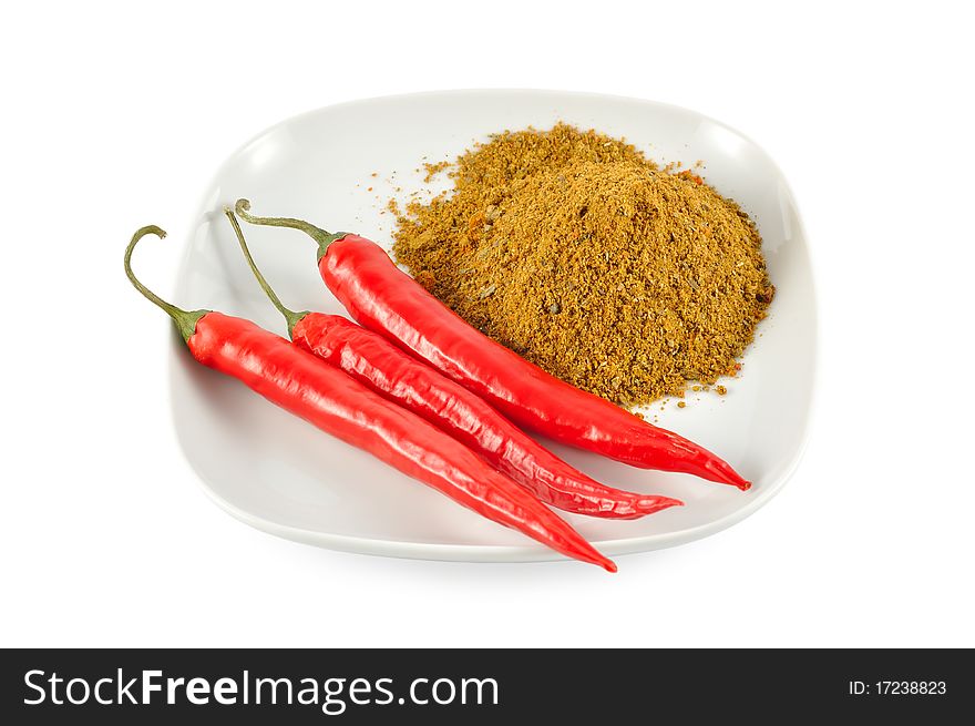 Red chilli and spices on the plate isolated on white background