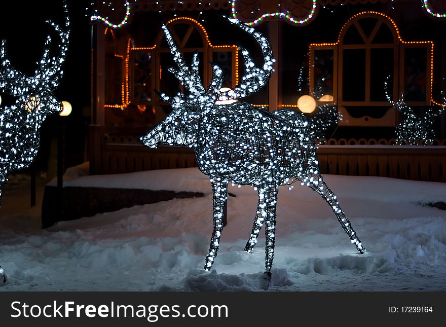 Glowing reindeer made of wire and light bulbs. Glowing reindeer made of wire and light bulbs