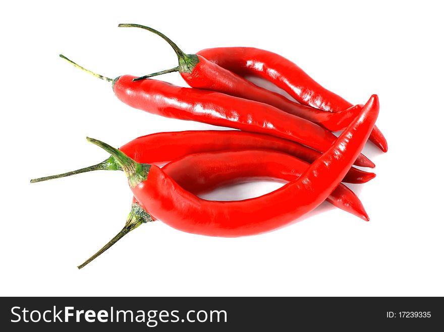 A handful of chili peppers on a white background