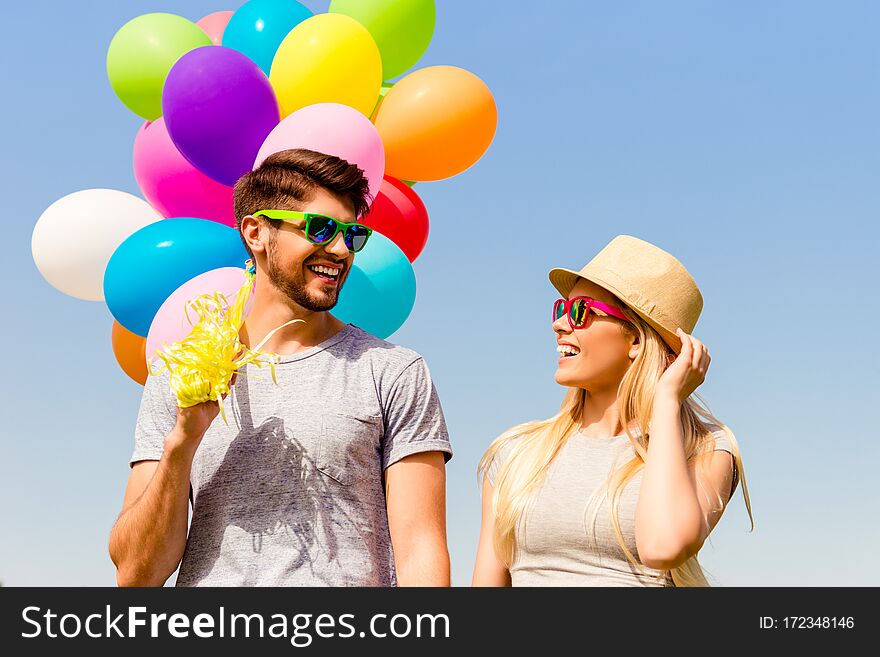 Portrait Of Cheerful Happy Family Having Walk With Balloons