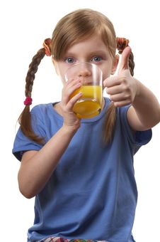 Young Funny Girl With A Glass Of Juice Stock Photo