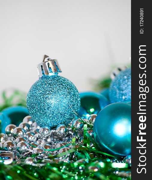 Blue Christmas balls laying on the table, white background. Blue Christmas balls laying on the table, white background