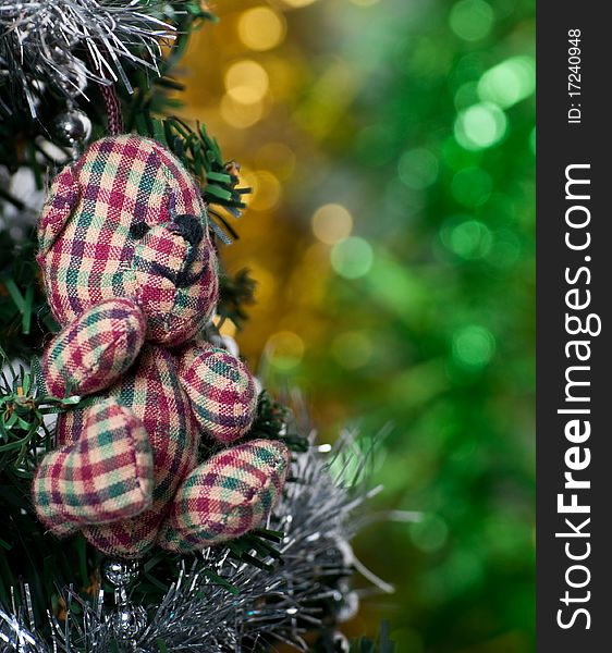 Bear hanging on the Christmas tree. Bear hanging on the Christmas tree