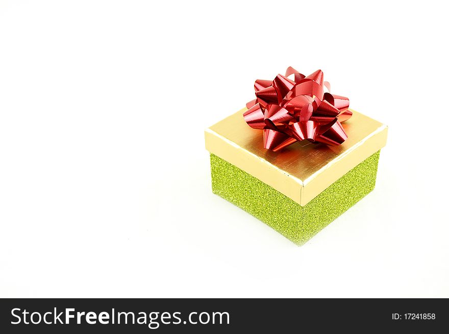 Gift  box with red ribbon  on a white buckground. Gift  box with red ribbon  on a white buckground