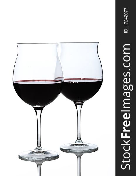 Half full wine glasses with red wine. Half full wine glasses with red wine