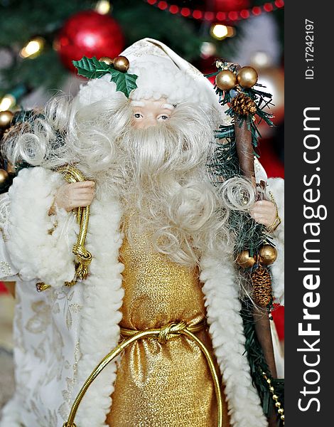 Porcelain Santa figurine with bag and staff. Porcelain Santa figurine with bag and staff.