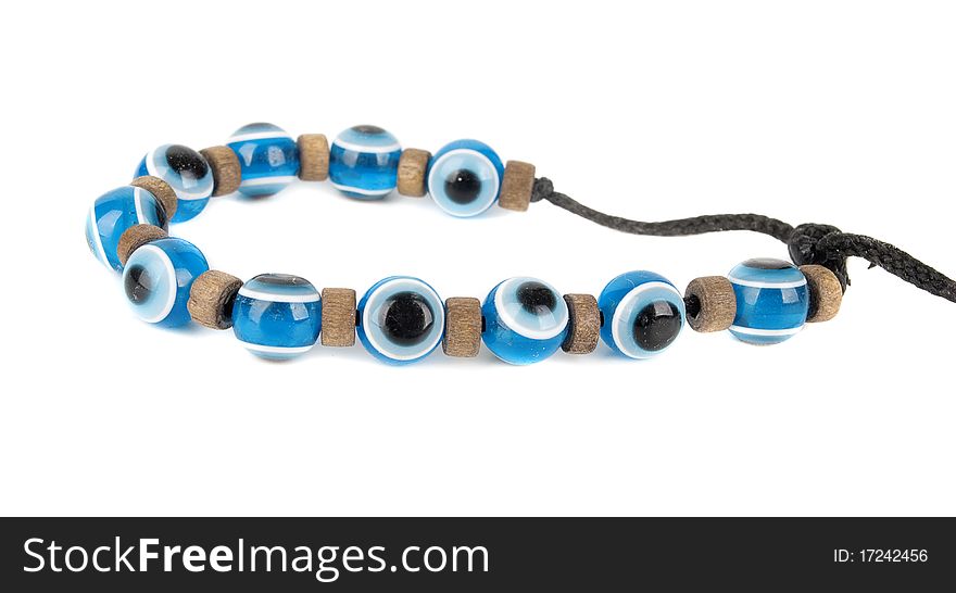 Evil eye children summer bracelet . Mediterranean people believed that evil eye keeps evil things away. Isolated on the white background. Evil eye children summer bracelet . Mediterranean people believed that evil eye keeps evil things away. Isolated on the white background.