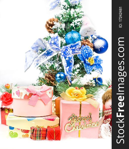 Christmas greeting gifts front of a christmas tree and snow mountain