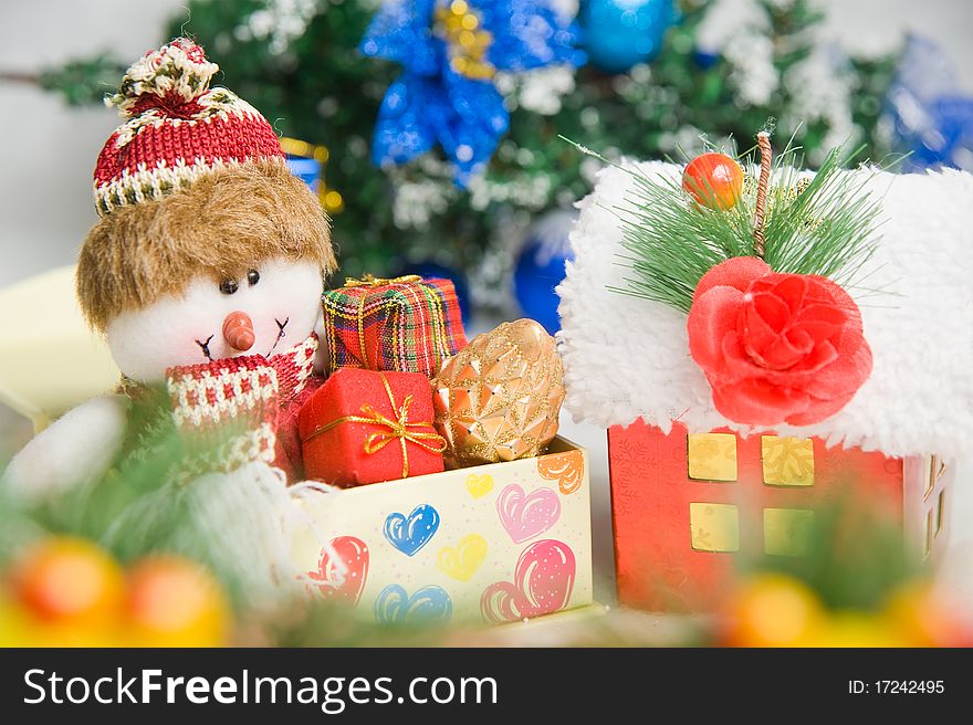 Christmas greeting Santa with gifts front of a christmas tree. Christmas greeting Santa with gifts front of a christmas tree