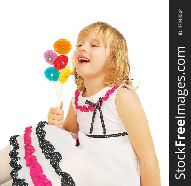 Portrait of little girl with lollipops isolated on the white background. Portrait of little girl with lollipops isolated on the white background.