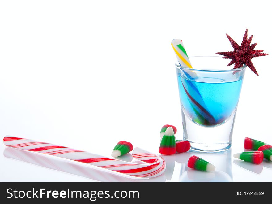 Christmas beverage, candies, canes and candycorns isolated on a white background. Christmas beverage, candies, canes and candycorns isolated on a white background