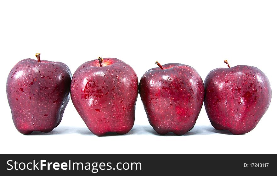 Four red apple isolated on white