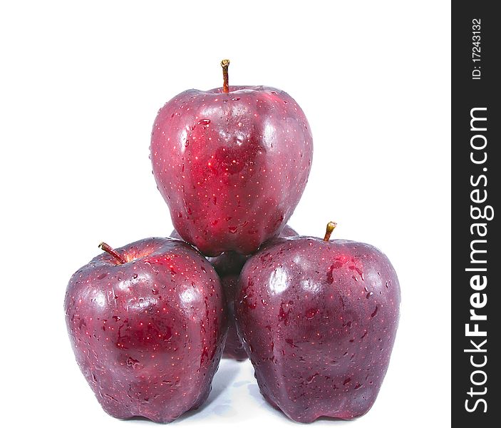 Four red apple balance isolated on white