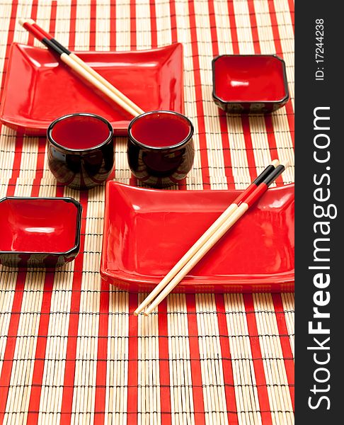 Close up at complete sushi set on the bamboo background. Close up at complete sushi set on the bamboo background