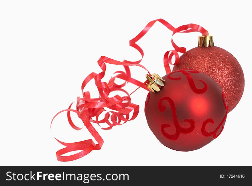 Two red Christmas baubles isolated on white background with copy space.