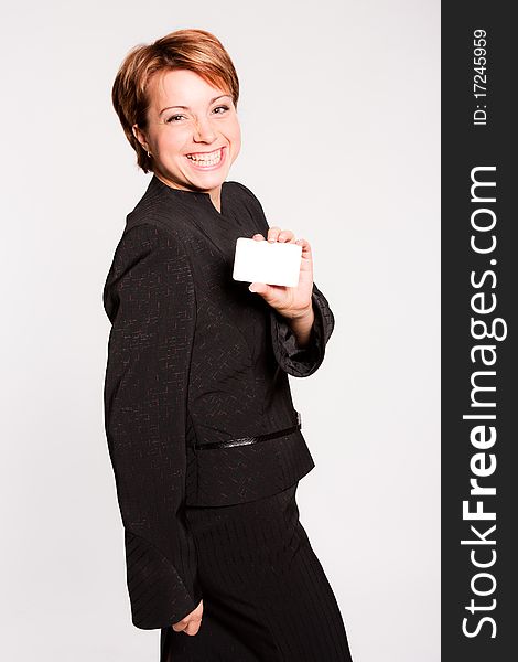 Beautiful business woman with empty card on white background