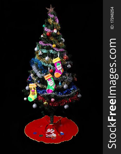 Christmas Tree and Gifts isolated on black background