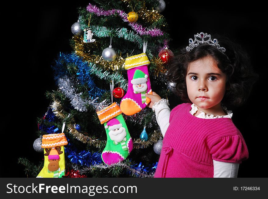 A girl and a christmas tree with presents. A girl and a christmas tree with presents