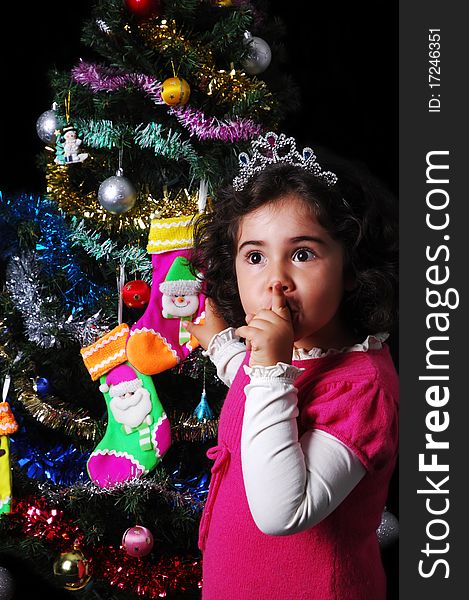 A girl and a christmas tree with presents. A girl and a christmas tree with presents