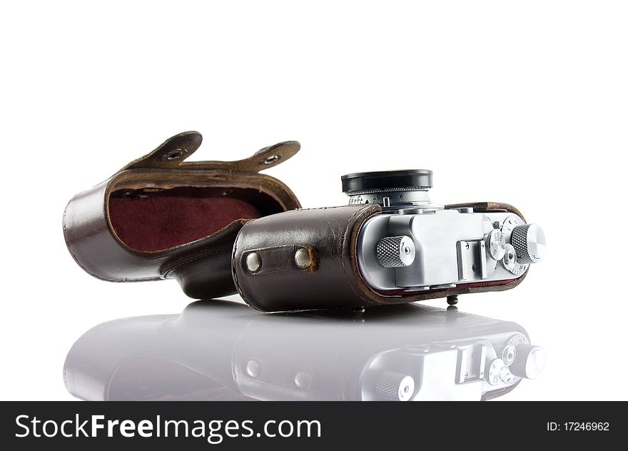 Vintage camera in old leather cover isolated on white