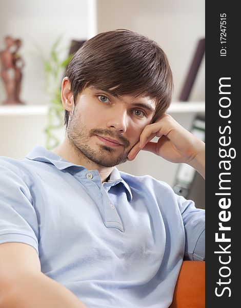 Portrait of young man resting on the sofa. Portrait of young man resting on the sofa