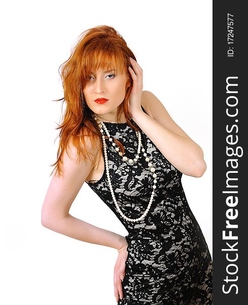 Beautiful red haired woman in lace black dress