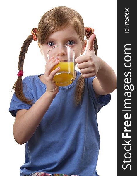 Young funny girl with a glass of juice over white background