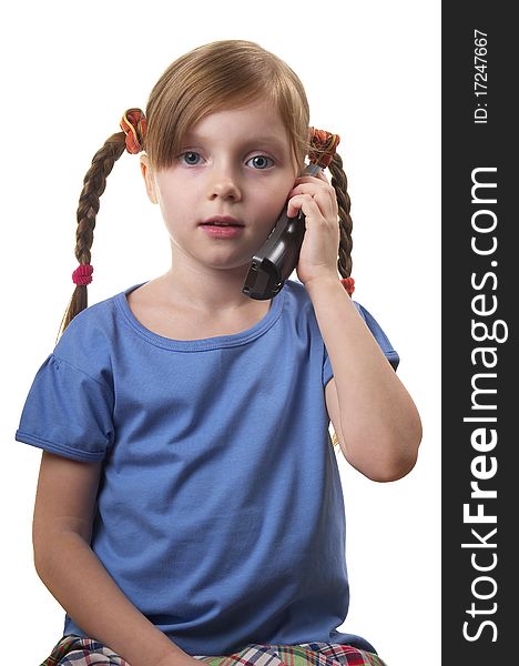 Funny smiling little girl takling by phone portrait isolated over white background. Funny smiling little girl takling by phone portrait isolated over white background